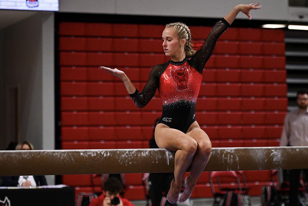 Senior Brooke Smead poses during her beam routine during the meet against Ohio State in Reynolds Coliseum on Friday, March 7, 2025. Smead scored 9.850 on the balance beam. NC State beat Ohio State 197.000-196.325.