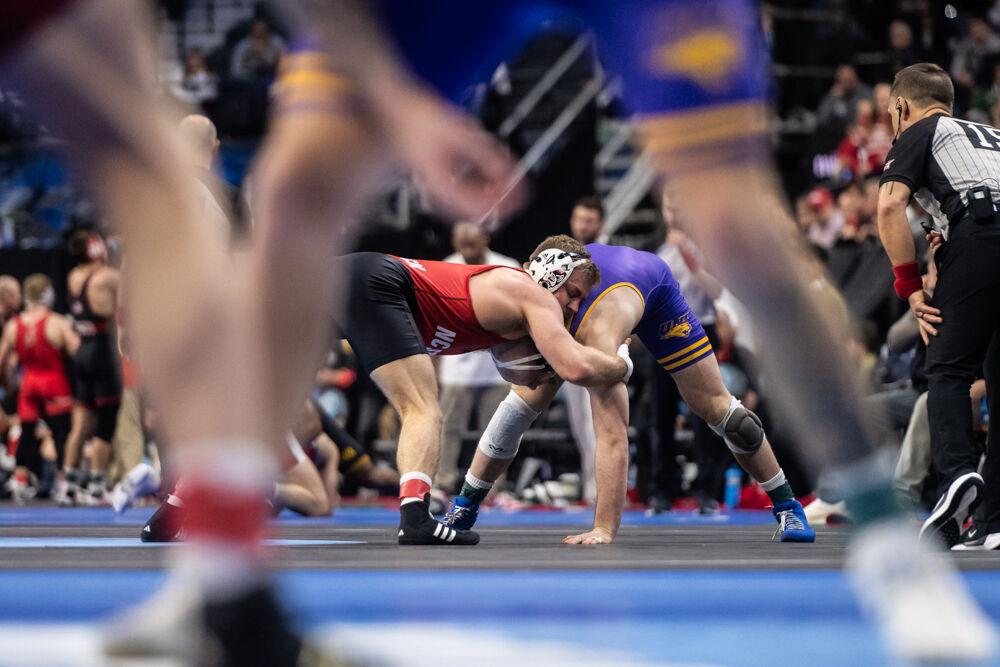 Redshirt sophomore Dylan Fishback struggles for control over his opponent in the second round of the NCAA Wrestling Championship Tournament in Wells Fargo Center on Thursday, March 20, 2025. NC State&#160;placed eighth overall with 46.5 points.
