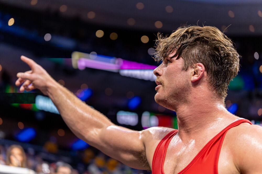 Redshirt junior Isaac Trumble celebrates his win during the NCAA Wrestling Championship Tournament in the Wells Fargo Center on Thursday, March 20, 2025. Trumble placed fourth in the heavyweight class. NC State placed eighth overall with 46.5 points.