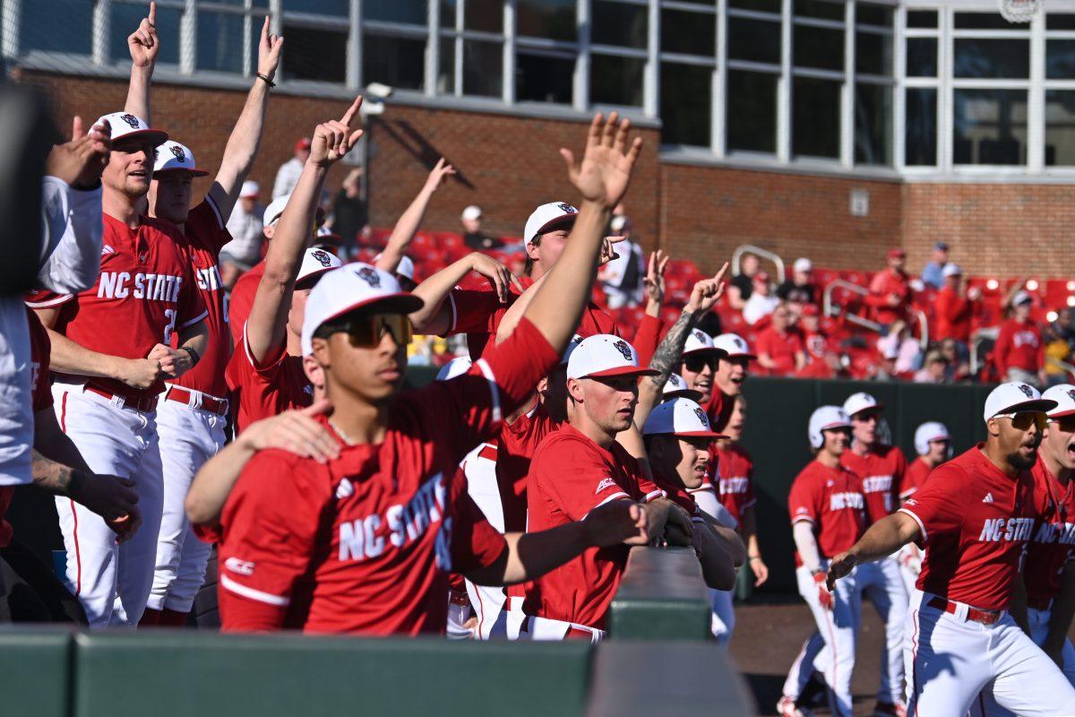 NC State baseball players celebrate freshman outfielder Ty Head's grand slam during the game against the Canisius Golden Griffins on Doak Field at Dail Park on Friday, Feb. 28, 2025. The Wolfpack beat the Golden Griffins 10-2 to take the first game of the series.