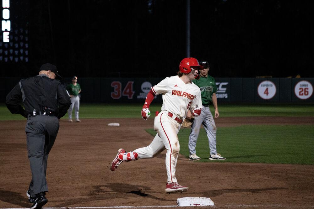 Junior infielder Matt Heavner rounds the bases after hitting a homerun during the game against USC-Upstate on Doak Field at Dail Park on Tuesday, March 25, 2025. Heavner scored two runs during the game. The game ended in the eighth inning due to the mercy rule.&#160;The Wolfpack lost to the Spartans 15-5.