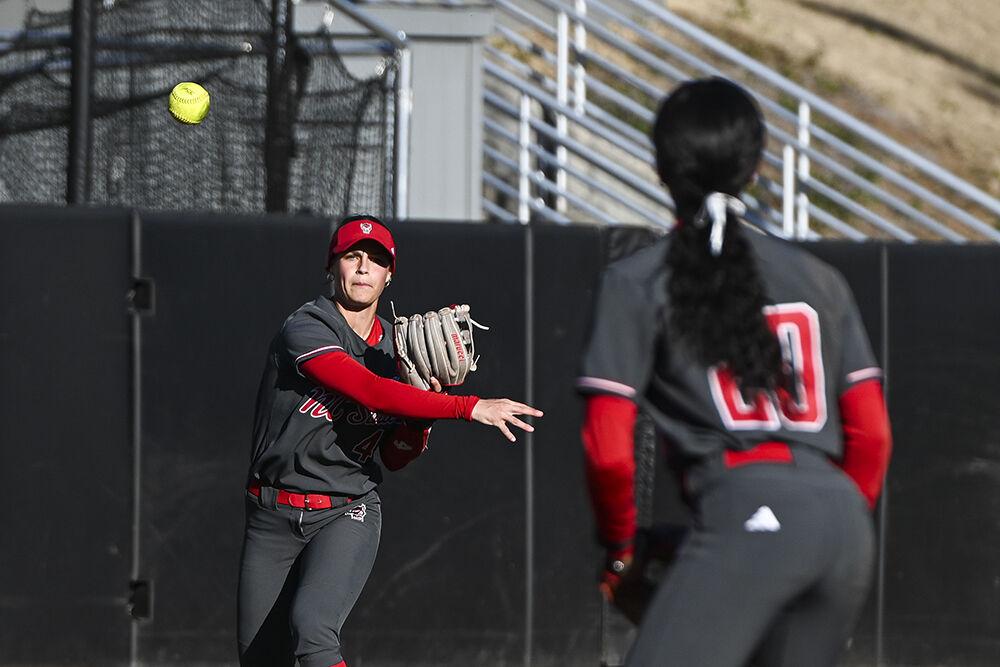 Sophomore outfielder Tori Ensley throws the ball to junior utility player MaKayla Marbury during the game against UNC-Wilmington at Dail Softball Stadium on Friday, Feb. 28, 2025. Ensley had one hit and Marbury hit a home run. NC State lost to UNC-Wilmington 5-4.