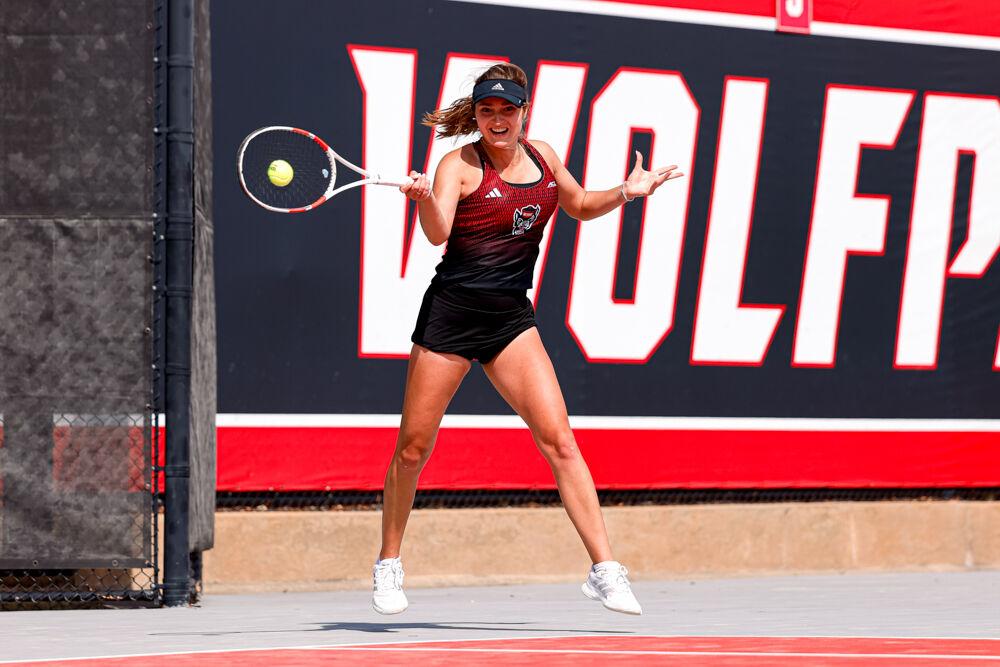 Sophomore Jasmine Conway hits the ball back during her doubles game against Clemson at J.W. Isenhour Tennis Center on Friday, March 28, 2025. Conway and Junior Anna Zyryanova won their doubles match 6-3. NC State won the match 4-0.