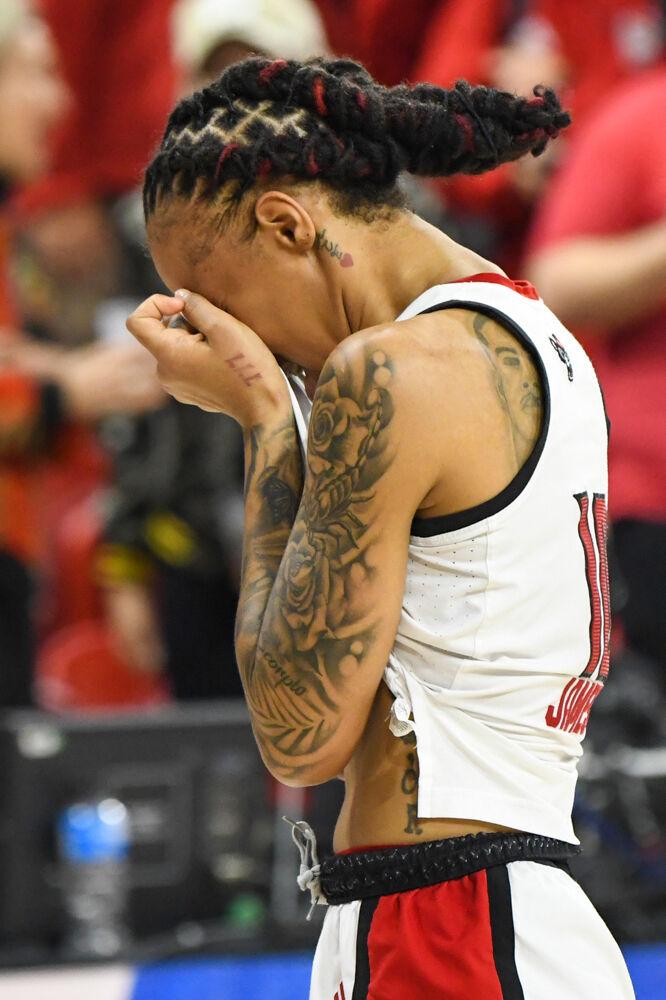 Senior guard Aziaha James covers her face at the conclusion of the second round game of the NCAA Tournament against Michigan State in Reynolds Coliseum on Monday, March 24, 2025. James led the team in points, scoring 26, and also made two blocks and six assists. NC State won the game 83-49.