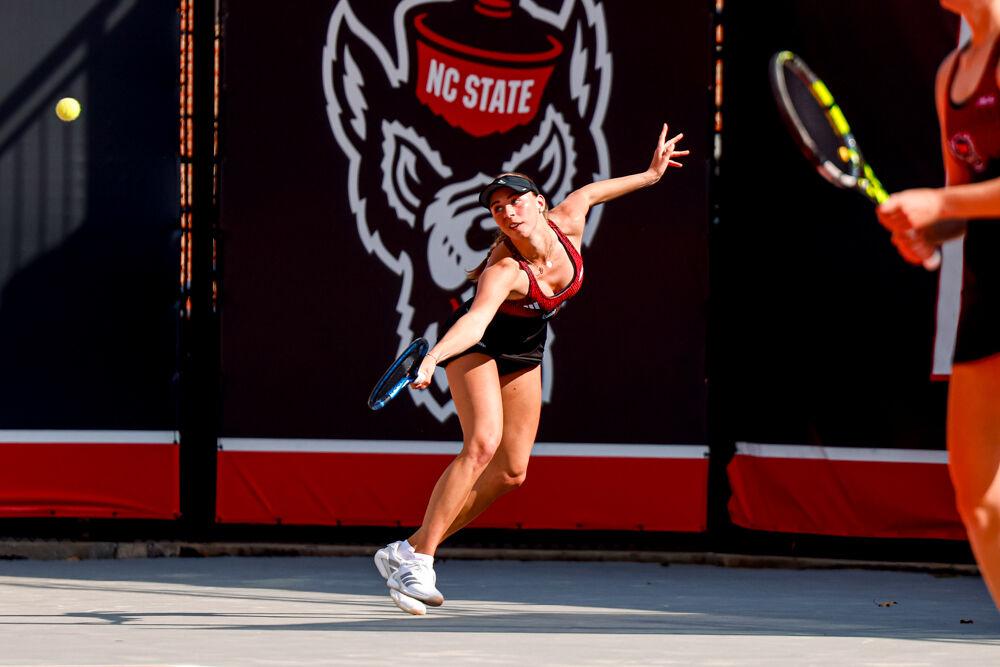Sophomore Kristina Paskauskas dives for the ball during her singles game against Clemson at J.W. Isenhour Tennis Center on Friday, March 28, 2025. Paskauskas won her doubles match 6-2. NC State won the match 4-0.