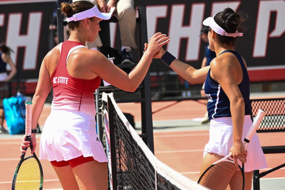 Junior Anna Zyryanova shakes her opponents hand after her singles match against Georgia Tech at J.W. Isenhour Tennis Center on Sunday, March 30, 2025. Zyryanova won both her singles match 6-2, 6-3. NC State beat Georgia Tech 4-3.
