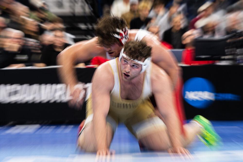 Redshirt junior Isaac Trumble starts in top position during his bout against former NC State wrestler Owen Trephan in the NCAA Wrestling Championship Tournament on Saturday, March 22, 2025. Trumble placed fourth and Trephan placed fifth in the heavyweight class. NC State placed eighth overall with 46.5 points.