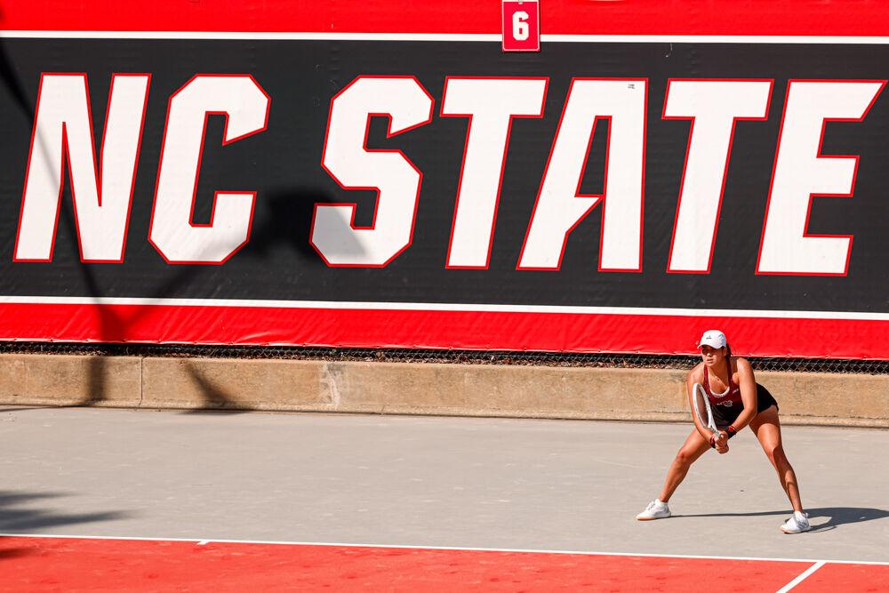 Freshman Mia Slama waits for her opponent to serve the ball back during her singles game against Clemson at J.W. Isenhour Tennis Center on Friday, March 28, 2025. Slama won her singles match 6-2, 6-2. NC State won the match 4-0.