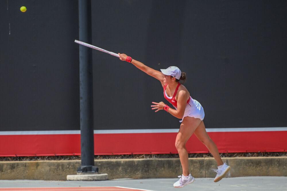 Freshman Mia Slama serves the ball during her singles match against Georgia Tech at J.W. Isenhour Tennis Center on Sunday, March 30, 2025. Slama won her singles match 7-5, 6-2. The Wolfpack beat the Yellow Jackets 4-3.