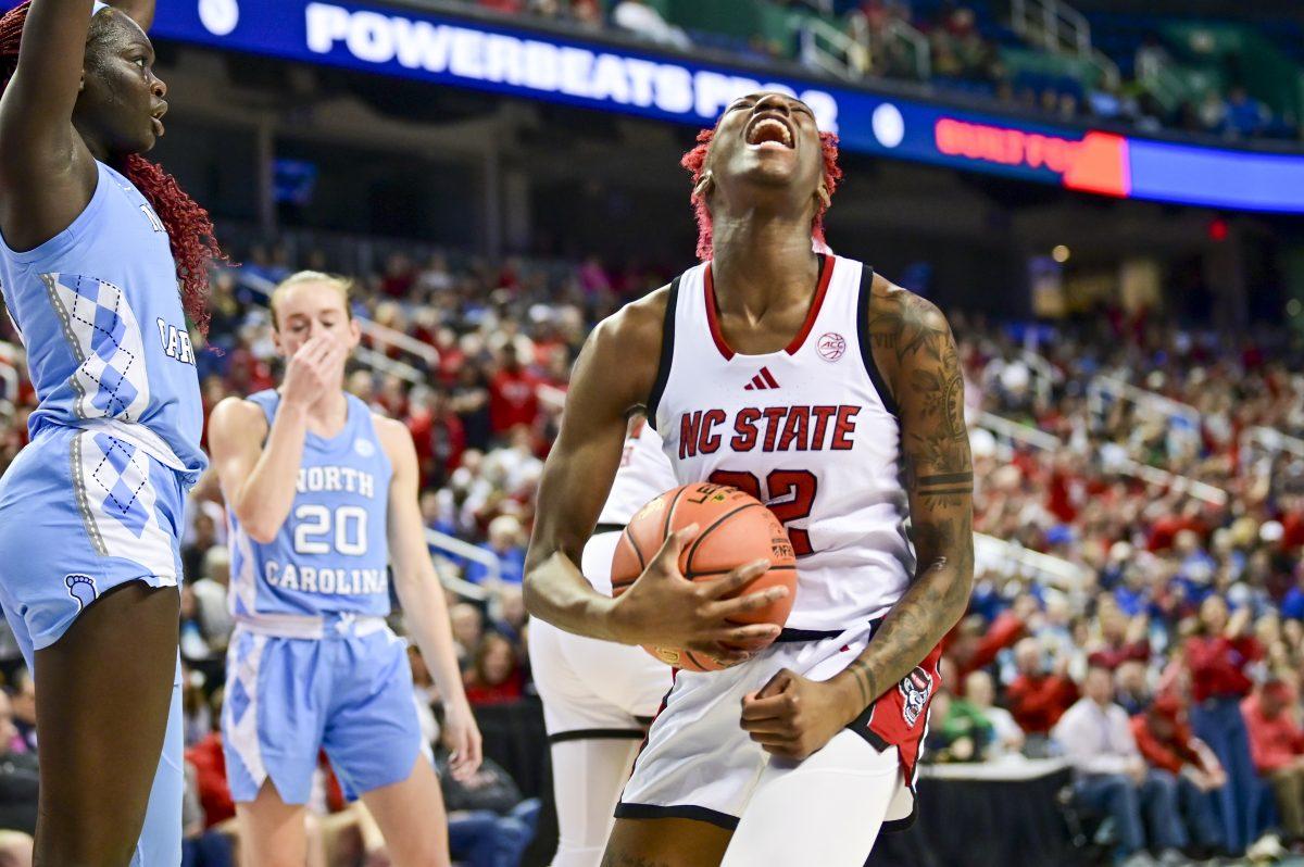 Senior guard Saniya Rivers celebrates after the opposing team fouls during the semifinals game of the ACC Tournament against UNC-Chapel Hill in Greensboro Coliseum on Saturday, March 8, 2025. NC State beat UNC 66-55.