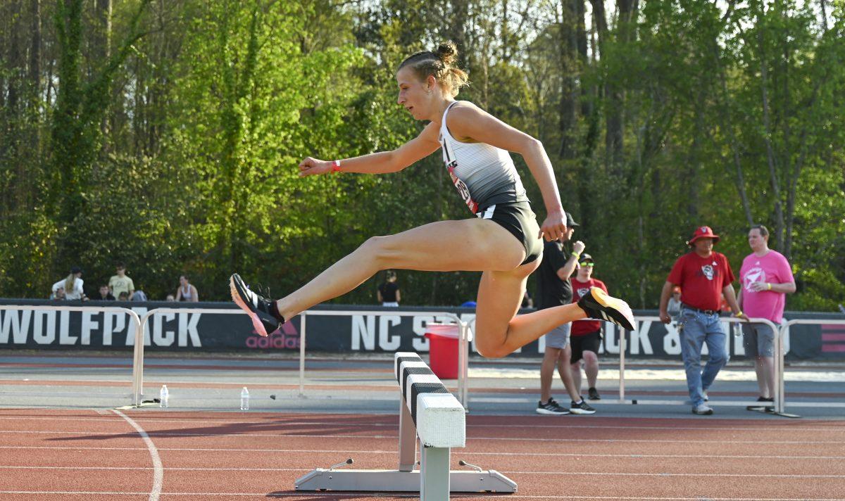 Sophomore distance runner Angelina Napoleon vaults over the barrier during the Raleigh Relays track meet at the Derr Track and Field Facility on Friday, March 28, 2025. Napoleon finished first in the 3000m steeplechase event with a time of 9:34.22, breaking the meet, facility and program record in the process. Napoleon currently holds the fastest 3000m steeplechase time in the NCAA.