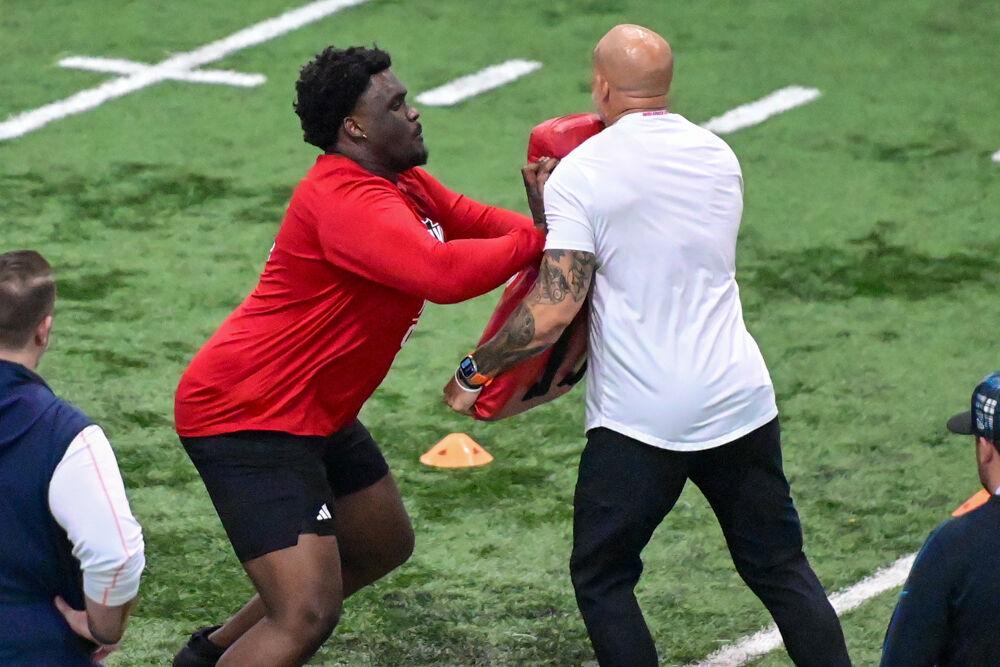 Graduate offensive tackle Anthony Belton performs an offensive drill during NC State football's Pro Day in the Close-King Indoor Practice Facility&#160;on Tuesday, March 25, 2025. NC State players performed a variety of tasks in front of NFL scouts before the upcoming draft.