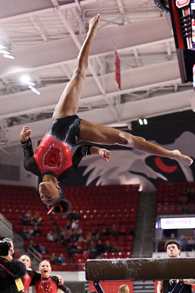 Sophomore Ashley Knight dismounts the beam during the meet against Ohio State in Reynolds Coliseum on Friday, March 7, 2025. NC State beat Ohio State 197.000-196.325.
