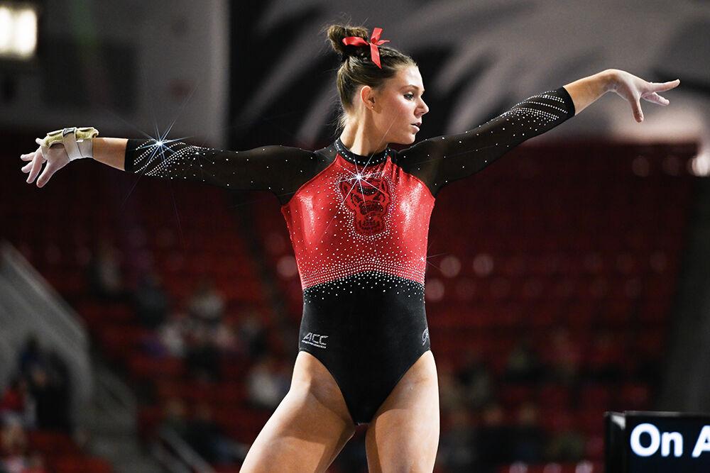 Freshman Caroline Volk poses during the meet against Ohio State in Reynolds Coliseum on Friday, March 7, 2025. Volk scored 9.900 on the balance beam. NC State beat Ohio State 197.000-196.325.