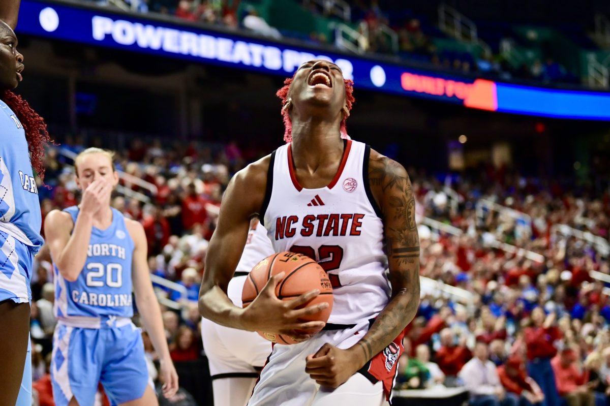 Senior guard Saniya Rivers celebrates after the referee calls a foul on the opposing team during the semifinals game of the ACC Tournament against UNC-Chapel Hill in Greensboro Coliseum on Saturday, March 8, 2025. NC State beat UNC 66-55.