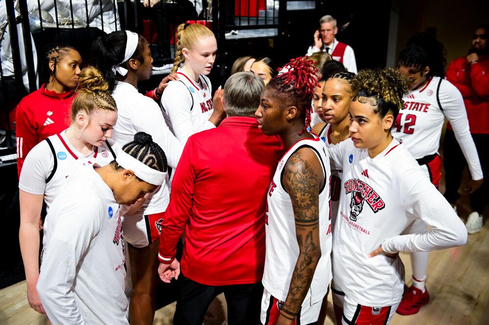 The women's basketball team huddles together before the second round game of the NCAA Tournament against Michigan State in Reynolds Coliseum on Monday, March 24, 2025. The Wolfpack beat the Spartans 83-49.
