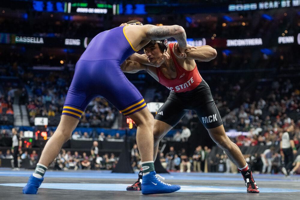 Redshirt sophomore Matty Singleton grapples with his opponent during the first round of the NCAA Wrestling Championship Tournament in Wells Fargo Center on Thursday, March 20, 2025.