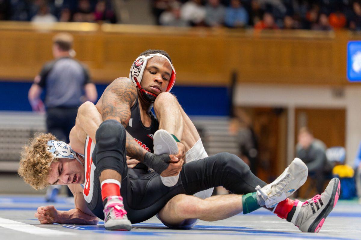 Redshirt freshman Vince Robinson fights for a takedown during the ACC Wrestling Championship Tournament in Cameron Indoor Stadium on Sunday, March 9, 2025. Robinson placed second in the 125 weight class. NC State placed third overall with 62.5 points.