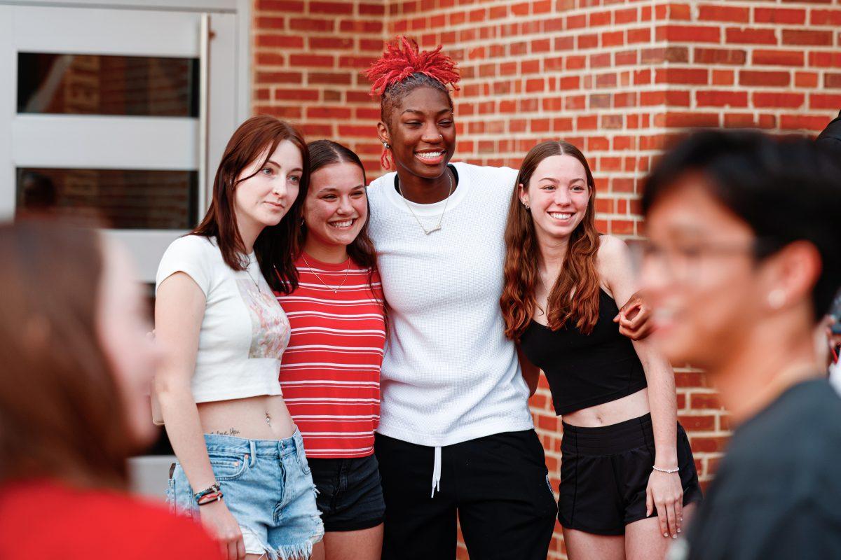 Senior guard Saniya Rivers poses with a group of fans during the team's welcome back to Reynolds Coliseum on Saturday, March 29, 2025. Rivers played 1192 minutes during her senior season.