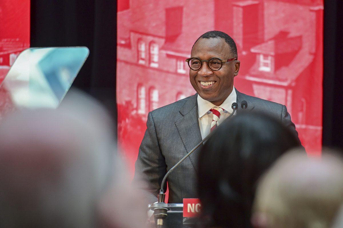 Chancellor-elect Kevin Howell smiles after walking on stage during the new chancellor announcement in Talley Student Union on Tuesday, March 18, 2025. Howell will be the 15th chancellor of NC State and the first Black chancellor. "I'm humble, i'm excited and i'm ready," said Howell.
