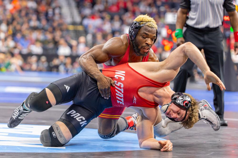Redshirt junior Derek Fields attempts to escape his opponent during the NCAA Wrestling Championship Tournament in the Wells Fargo Center on Thursday, March 20, 2025.