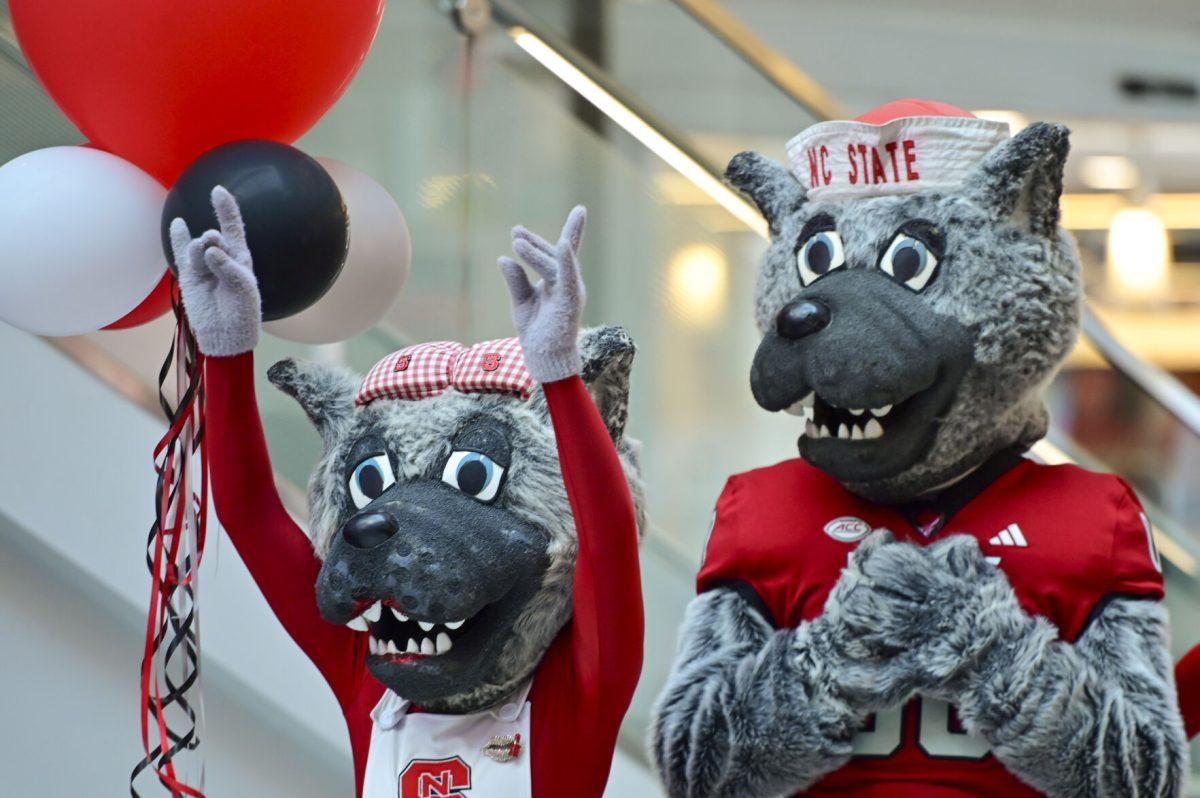 Mrs. and Mr. Wuf reacts as chancellor-elect Kevin Howell talks during the new chancellor announcement in Talley Student Union on Tuesday, March 18, 2025. Howell will be the 15th chancellor of NC State and the first Black chancellor.