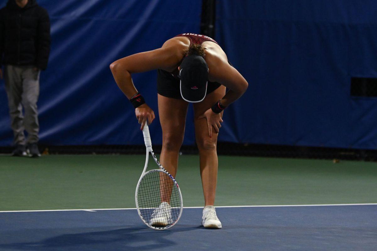 Freshman Mia Slama slumps after the loss of her singles match during the match against Duke at Ambler Tennis Stadium on Friday, March 21, 2025. Slama lost her singles match 1-2 and NC State fell to Duke 3-4.
