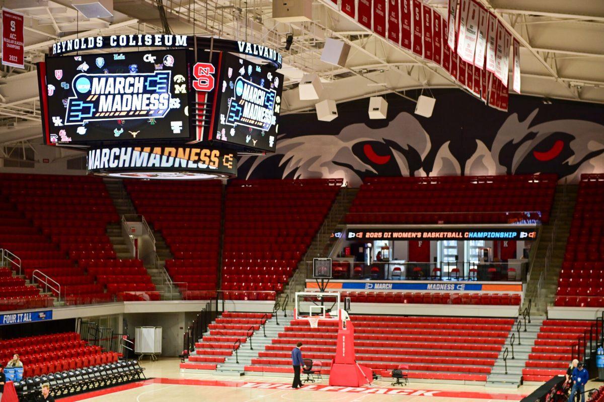 March Madness displays light up the court before the first round game of the NCAA Tournament against Vermont in Reynolds Coliseum on Saturday, March 22, 2025. The Wolfpack beat the Catamounts 75-55.