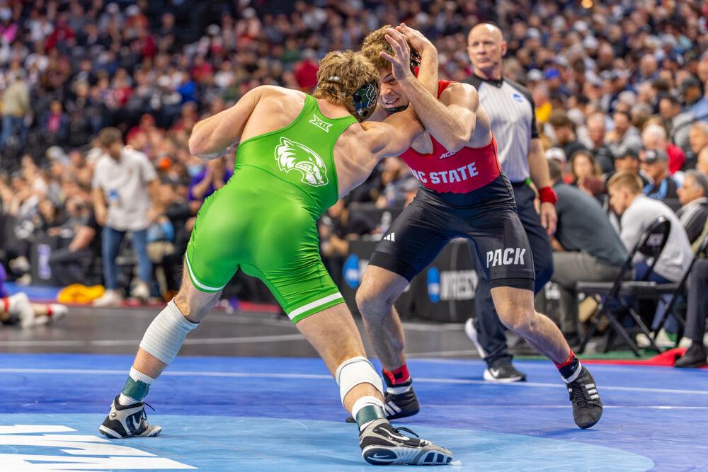 Redshirt junior Derek Fields grapples with his opponent during the NCAA Wrestling Championship Tournament in the Wells Fargo Center on Thursday, March 20, 2025.&#160;The Wolfpack placed eighth overall with 46.5 points.