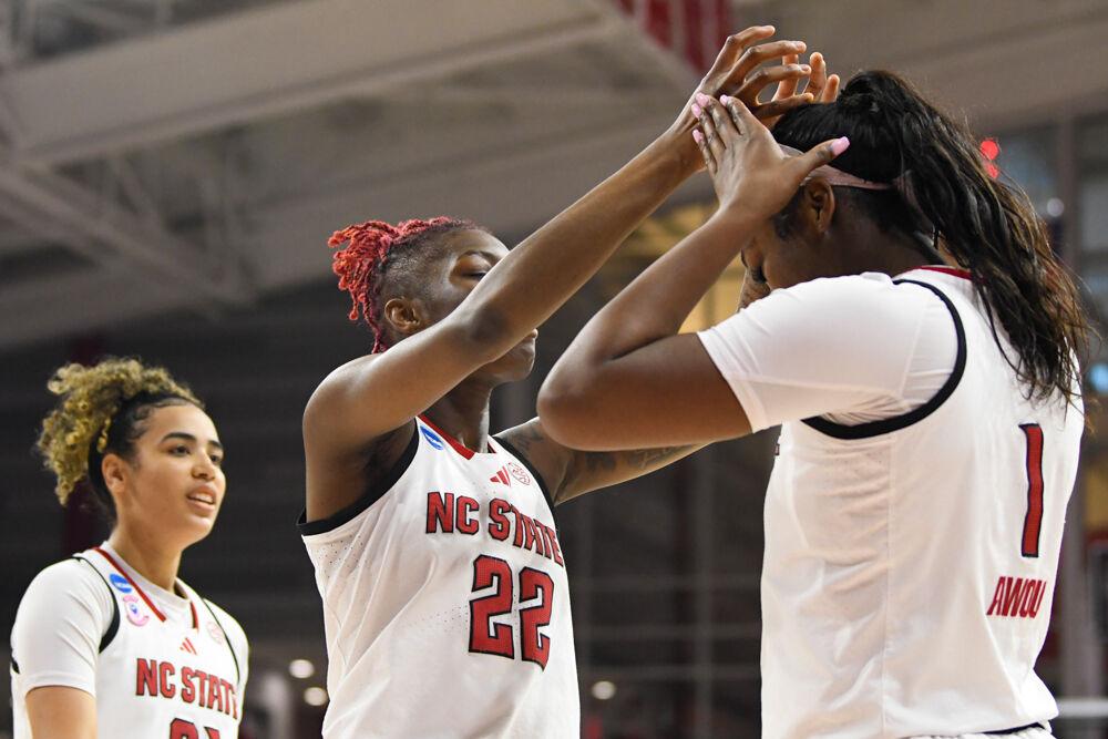 Senior guard Saniya Rivers crowns freshman center Lorena Awou during the second round game of the NCAA Tournament against Michigan State in Reynolds Coliseum on Monday, March 24, 2025. Awou made eight rebounds and two blocks. NC State won the game 83-49.
