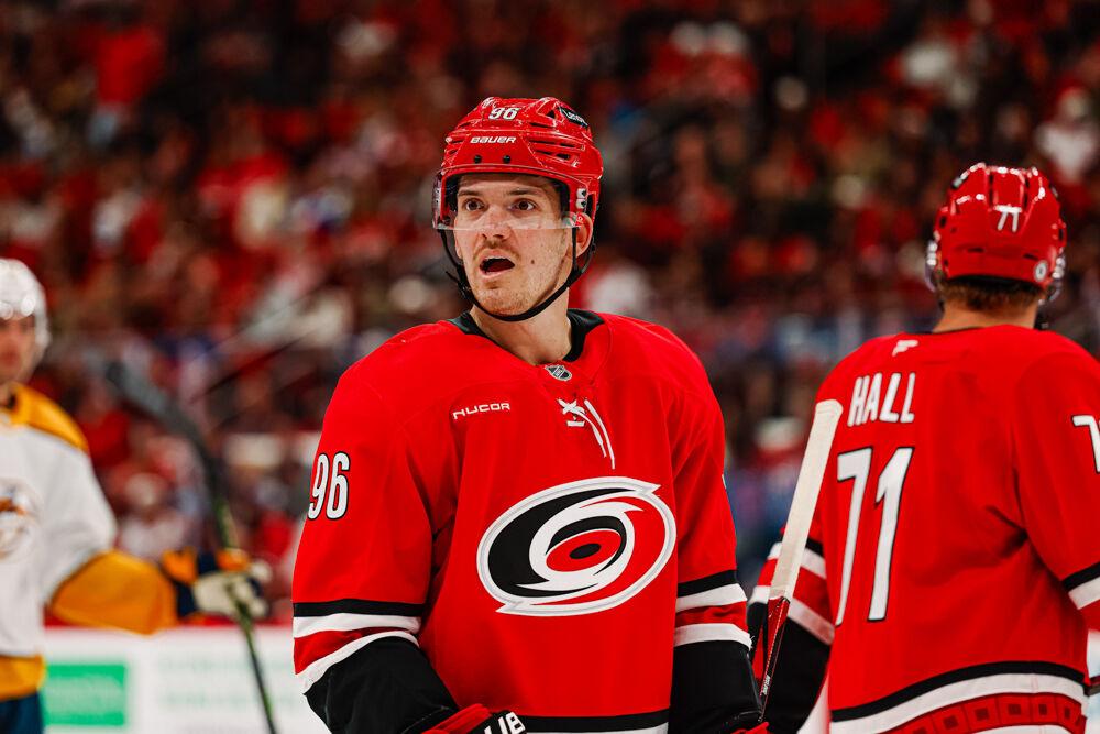 Center Jack Roslovic talks to his teammate during a timeout in the game against the Nashville Predators at the Lenovo Center on Tuesday, March 25, 2025. Roslovic attempted four shots on the goal. The Hurricanes lost 3-1.