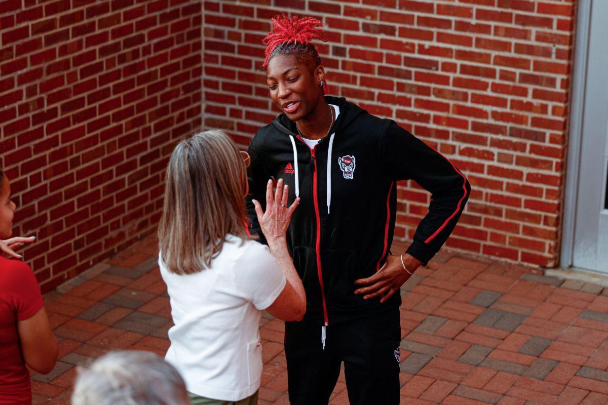 Senior guard Saniya Rivers smiles while talking with a fan during their welcome back to Reynolds Coliseum on Saturday, March 29. Rivers scored 415 points during her senior season.