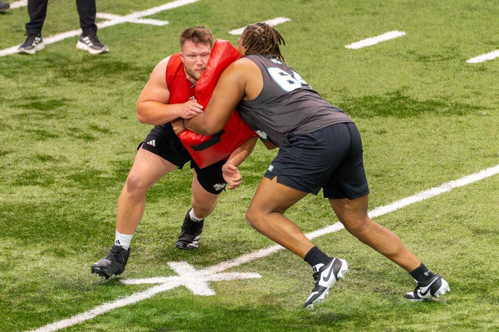 Graduate center Zeke Correll performs a bag drill during NC State football's Pro Day in the Close-King Indoor Practice Facility&#160;on Tuesday, March 25, 2025. NC State players performed various tasks in front of NFL scouts before the upcoming draft.