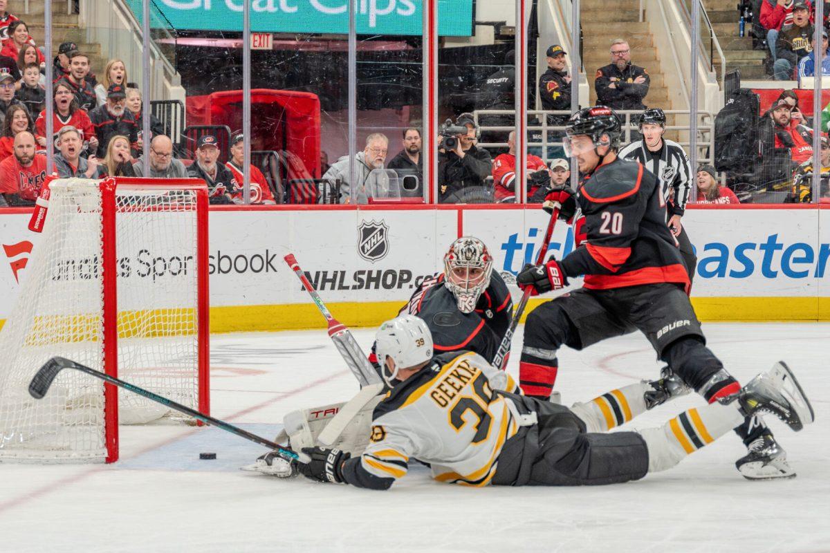 Forward Sebastian Aho races for the puck on the goal line during the game against the Boston Bruins at the Lenovo Center on Saturday, March 6, 2025. Aho had one shot on goal. The Hurricanes beat the Bruins 3-2.