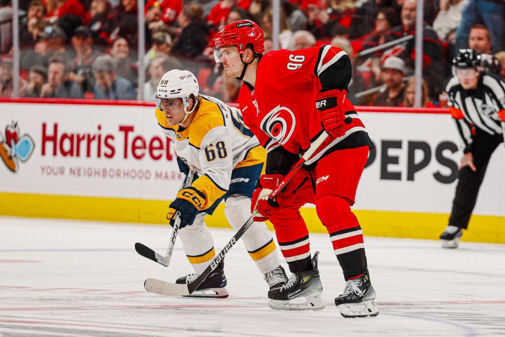 Center Jack Roslovic prepares for a face-off during the game against the Nashville Predators at the Lenovo Center on Tuesday, March 25, 2025. Roslovic attempted four shots on the goal. The Hurricanes lost 3-1.
