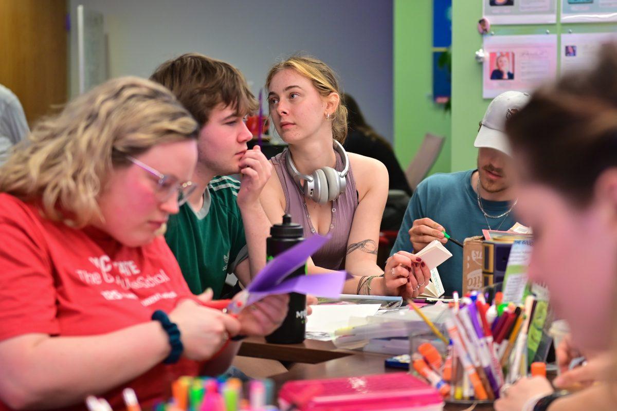 Students make zines at the Womanist History of Scrapbooks and Zines event at the Women's Center on Tuesday, March 25, 2025. The Women's Center, located on the fifth floor of Talley Student Union, hosted the event.