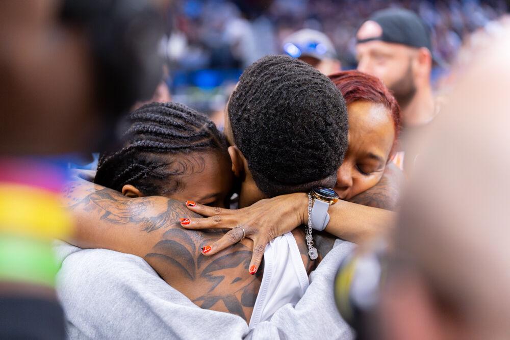 Redshirt freshman Vince Robinson celebrates his championship win with his family during the NCAA Wrestling Championship Tournament in the Wells Fargo Center on Saturday, March 22, 2025. The Wolfpack placed eighth in the tournament with 46.5 points.