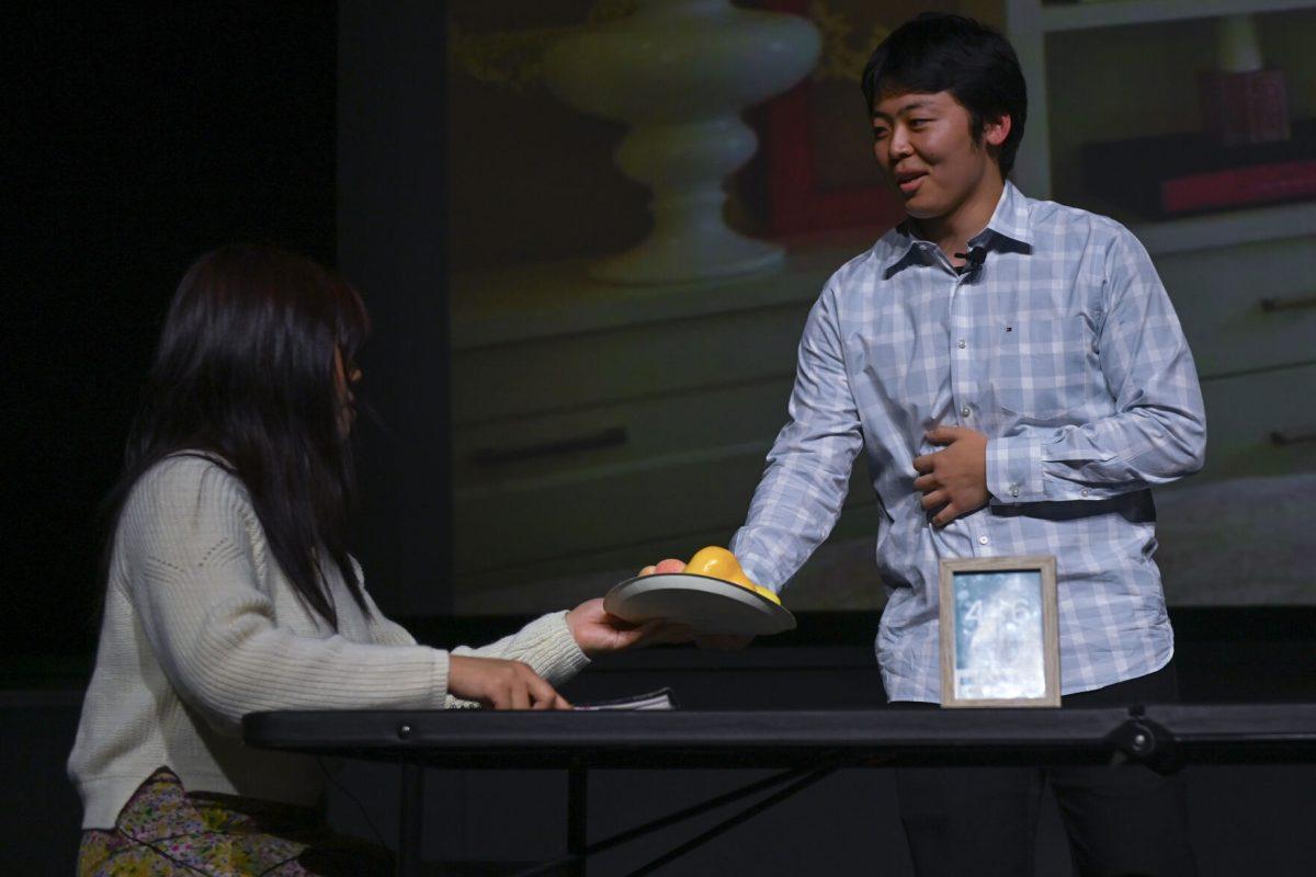 Hillary Luc, a first-year studying business management, and Casey Rhee, a third-year studying environmental engineering share a moment as Lien and her father during the Vietnamese Student Association's annual spring semester culture show, The Art of Passion, at Witherspoon Student Center on March 22, 2025. The show, hosted by NC State's VSA, featured guest performances and an engaging story about Lien, a young girl on her journey to find her true passion, and explored her family values and emerging romances.