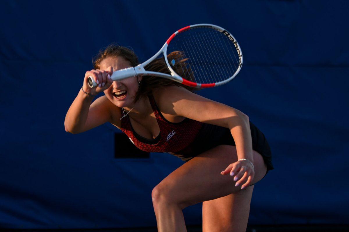 Sophomore Jasmine Conway winces as she swings her racket during the match against Duke at Ambler Tennis Stadium on Friday, March 21, 2025. NC State fell to Duke 3-4.