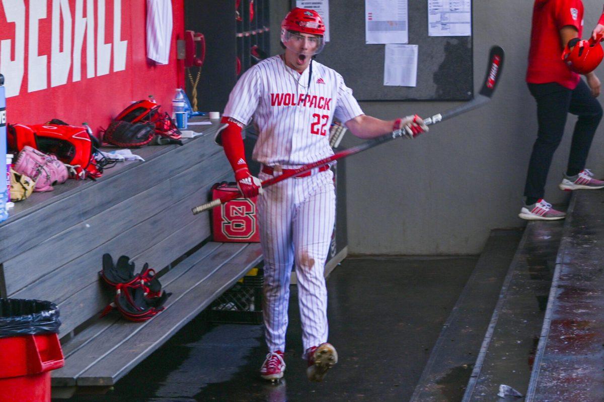 Junior outfielder Josh Hogue celebrates in the dugout after hitting a grand slam during the game against Campbell on Doak Field at Dail Park on Wednesday, March 5, 2025. The Wolfpack defeated the Fighting Camels 11-1. Hogue recorded one hit, a grand slam, which drove in four RBIs, along with one walk and no strikeouts.