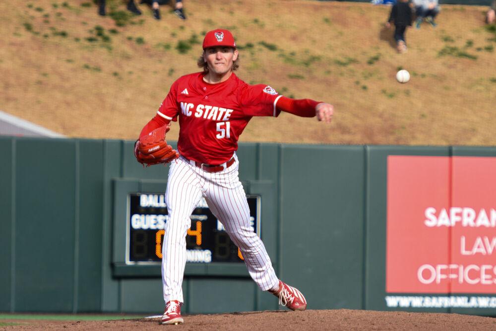 Junior pitcher Dominic Fritton picks off a runner at first base during the game against Wright State&#160;on Doak Field at Dail Park&#160;on Friday, March 7, 2025. Fritton pitched six innings and 103 pitches. The Wolfpack defeated the Raiders 6-4.