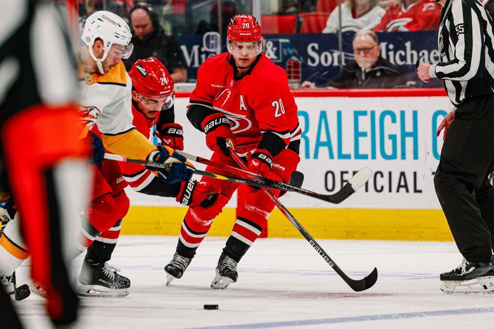 Center Sebastian Aho attemps to get the puck free during the game against the Nashville Predators at the Lenovo Center on Tuesday, March 25, 2025. Aho attempted 3 shots on the goal. The Hurricanes lost 3-1.