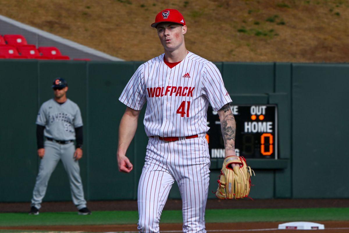 Sophomore pitcher Jacob Dudan looks to the dugout after striking out a batter during the game against Campbell on Doak Field at Dail Park on Wednesday, March 5, 2025. The Wolfpack defeated the Fighting Camels 11-1. Dudan struck out six batters and earned a win as the pitcher.
