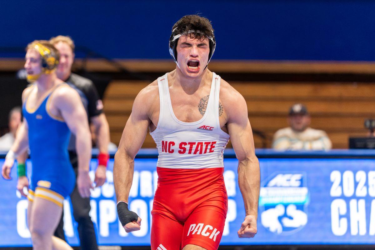 Redshirt sophomore Matthew Singleton celebrates winning his final bout during the ACC Wrestling Championship Tournament in Cameron Indoor Stadium on Sunday, March 9, 2025. Singleton won the championship for the 174 weight class. NC State placed third in the tournament with 62.5 points.