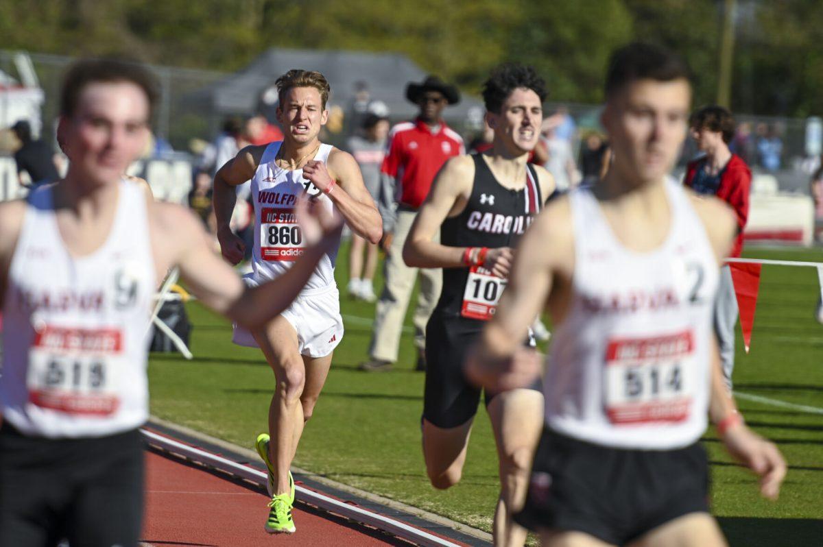 Graduate distance runner Brett Gardner pushes himself as he approach the finish line during the Raleigh Relays track meet at the Derr Track and Field Facility on Thursday, March 27, 2025. Gardner earned a personal best in the 1500m with a time of 3:42.18.