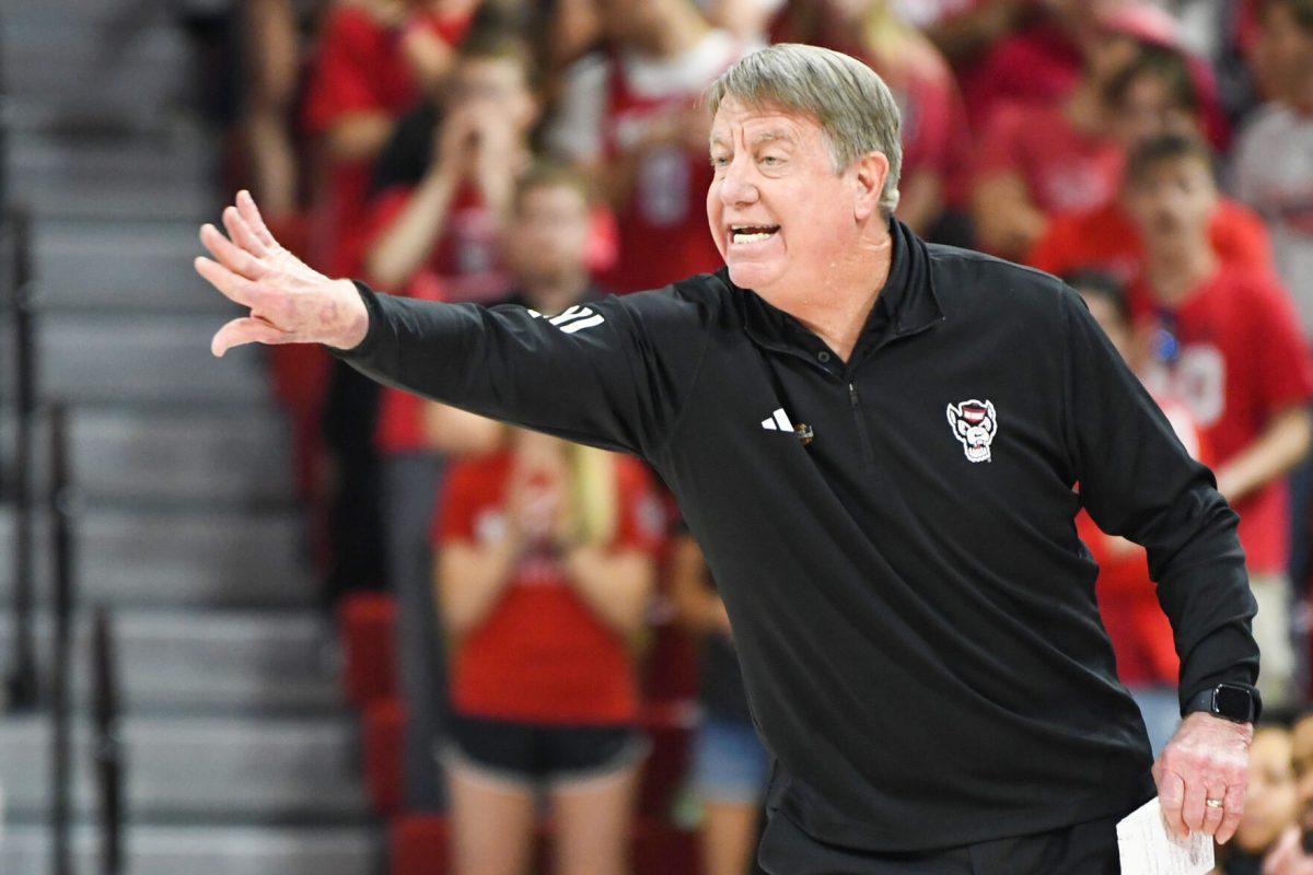 Head coach Wes Moore gestures to his players during the first round game of the NCAA Tournament against Vermont in Reynolds Coliseum on Saturday, March 22, 2025. This win marked Moore's 300th win at NC State. The Wolfpack beat the Catamounts 75-55.
