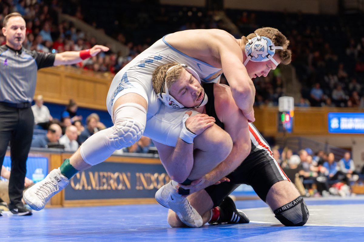 Redshirt sophomore Dylan Fishback drives in on a single-leg during the ACC Wrestling Championship Tournament in Cameron Indoor Stadium on Sunday, March 9, 2025. Fishback placed second in the 184 weight class. NC State placed third overall with 62.5 points.