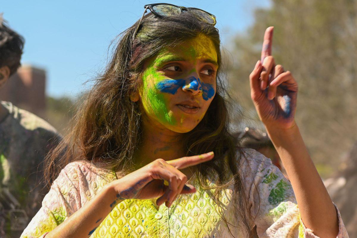 Siddhi Mule, a graduate student studying computer science, dances with friends during Holi at Stafford Commons on Saturday, March 22, 2025. Holi was thrown by EKTAA, NC State's South Asian Student Association.