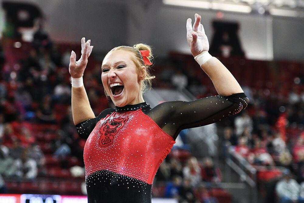 Graduate Krista Zultevicz celebrates sticking her landing during the meet against Ohio State in Reynolds Coliseum on Friday, March 7, 2025. Zultevicz scored 9.775 in her floor routine. NC State defeated Ohio State 197.000-196.325.