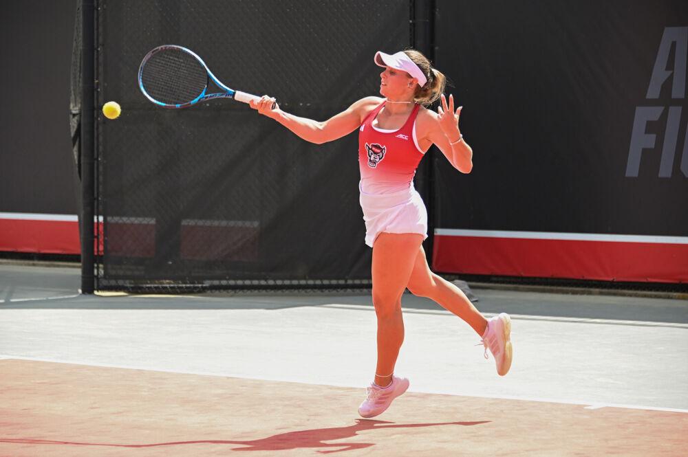 Sophomore Gabriella Broadfoot reaches for the ball during her singles match against Georgia Tech at J.W. Isenhour Tennis Center on Sunday, March 30, 2025. Broadfoot won her singles match 6-4, 3-6, 6-1. The Wolfpack beat the Yellow Jackets 4-3.